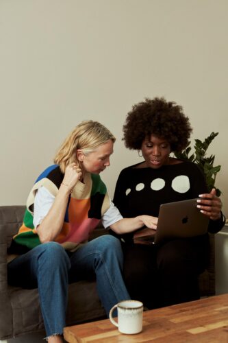 midlife women together on computer